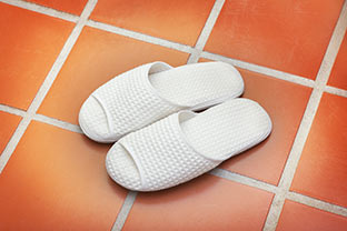 Slippers on warm tile floor